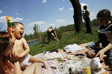 A policeman and his family picnic by the Dnister (Nistru) River.