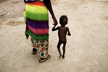 A mother walks with her child at a Medecins Sans Frontieres (MSF) centre for severely malnourished children.