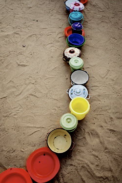 A line of bowls left out by women prior to food distribution at a Medecins Sans Frontieres (MSF) centre for severely malnourished children.
