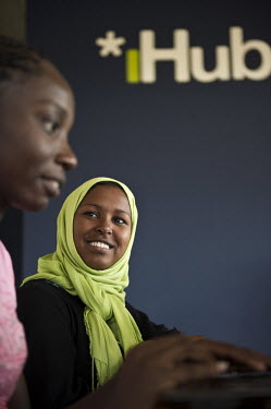 Susan Oguya and Jamila Abass, founders of Akirachix, developed a mobile phone application for farmers in rural areas, called M-Farm. Here at work at iHup, Nairobi's innovation hub for the technology c...