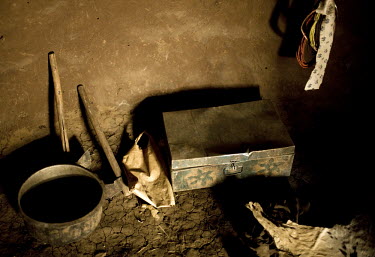 A few tools, some skins, a bowl and a metal box represent the minimal possessions of a family of pastoralists.