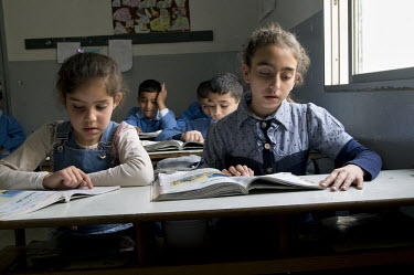 Children in a class at a mixed Christian and Muslim school.