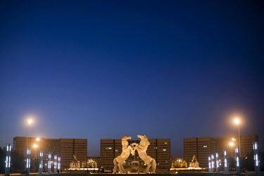 A giant statue of a pair of rearing horses that stands in front of the government headquarters in Linyinlu Square in the Kangbashi district Ordos. The Kangbashi District of Ordos, a district planned,...