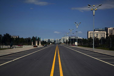 An empty street at midday in Ordos. The Kangbashi District of Ordos, a district planned, five years ago, for 1 million inhabitants, still lies almost dormant and has become known as a 'Modern Ghost Ci...