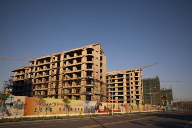 A construction site in Ordos. Despite many of the properties in the city being empty, new developments continue to be built. The Kangbashi District of Ordos, a district planned, five years ago, for 1...