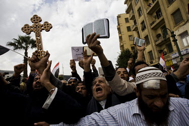 Coptic Chirstians and the Muslim Brotherhood join together in a rare and fleeting show of unity to protest against President Mubarak. 25 January 2011 saw the beginning of a nationwide 18 day protest m...