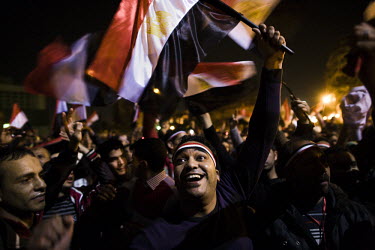 Anti-government protesters waving flags and celebrating in Tahrir Square as rumours begin to come in that President Hosni Murbarak is about to give a televised address to the nation to announce his re...