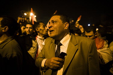 Thousands of anti-government protesters gather in front of a television set up in Tahrir Square to watch the expected resignation of President Hosni Mubarak. However, they react angrily when Mubarak f...