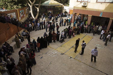 People queue to cast their vote in the referendum held to decide when and how a government should be formed following the resignation of President Hosni Mubarak. 25 January 2011 saw the beginning of a...