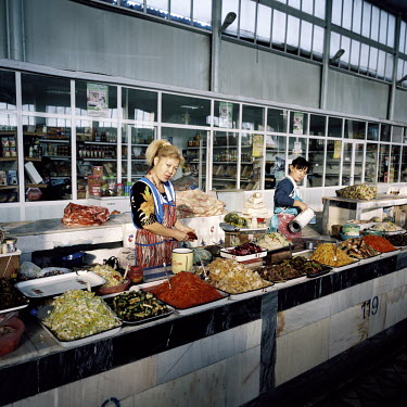 Market traders prepare Kimchi, a locally made dish of spiced vegetables, at the central Nukus covered market.