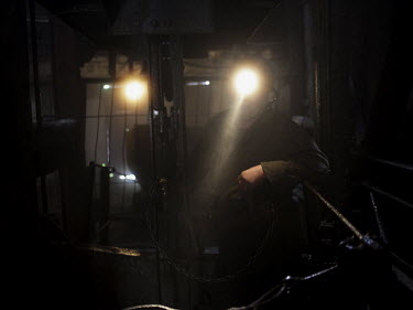 A miner stands in the lift In the Navagrodovskaya coal mine, West Donetsk.