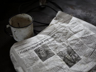 A newspaper and a tin cup at the Navagrodovskaya coal mine, West Donetsk.