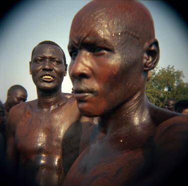 Men decorated with ochre and marked with face scarifications dance near the tomb of John Garang, former rebel leader and head of the Sudan People's Liberation Army (SPLA) during independence celebrati...