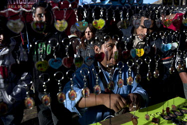 A man selling keyrings during the carnival celebrations in Oruro. The Devils of Oruro is a traditional celebration in which hundreds of dancers from all over Bolivia come to perform in the streets of...