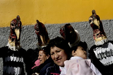 A group of men dressed in Condor costumes during celebrations in Pisac for the Virgin of El Carmen.