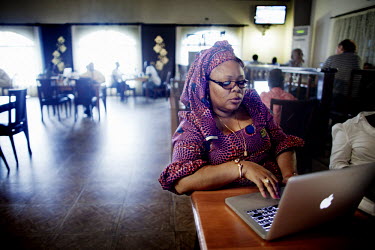 Peace activist Leymah Gbowee works from her computer at a hotel in Monrovia. Leymah Gbowee was awarded the 2011 Nobel Peace Prize along with two other women for their non-violent approach to building...
