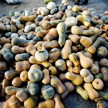 A pile of squash is dropped outside an apartment block in central Nukus.
