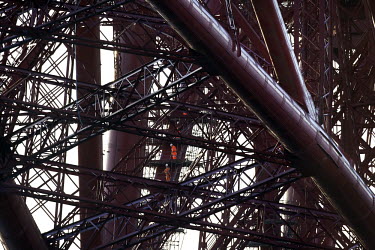 Workers dismantle scaffolding which was erected during painting works along all parts of the 125 year old Forth Rail Bridge which spans the river Forth near Edinburgh. Network Rail, the operator of th...