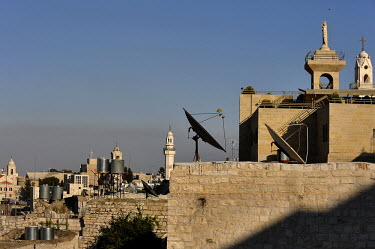 Minarets, churches, water tanks and satellite dishes in Bethlehem, believed to be the birth place of Jesus Christ.