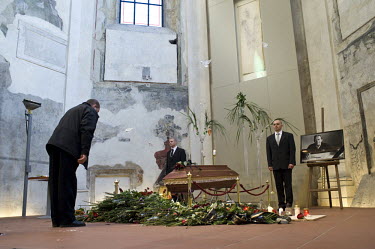 A man pays his respects in front of the coffin of Vaclav Havel in the 'Prague Crossroads', a former church which was turned into a cultural centre by Havel. Havel was a playwright, essayist and poet w...