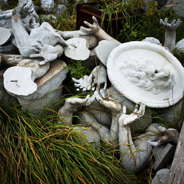 Broken parts of sculptures lying next to a wall at the Venecia Palace Hotel. The hotel was built in 2008 by Polish businessman Waclaw Gozlinski, who concluded that potential guests, exposed to a diet...