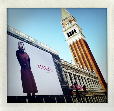 A huge billboard advertisement for fashion brand Max&Co. in the Piazza San Marco next to the The Campanile.