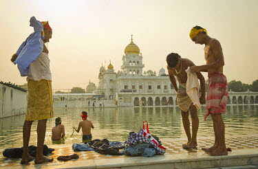 Sikhs bathe in the early morning at the Gurdwara Bangla Sahib in New Delhi.