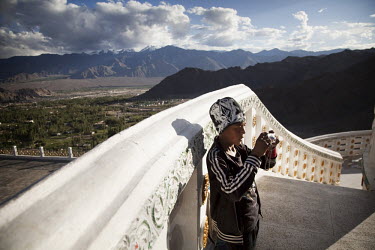 Tourists take pictures at the Shanti Stupa. Leh has seen a boom in tourism, first from Westerners eager to see the confluence of Tibetan, Chinese and Hindu cultures, and now, increasingly by Indian to...