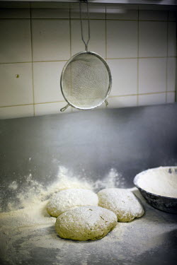 Details of pie dough in the kitchens of F Cooke's Pie and Mash shop in Hoxton, London.