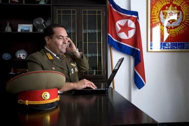 A portrait of Alejandro Cao de Benos, photographed in the village of Salomo in northeast Spain talking on a mobile phone. As a Korean-Spanish communist, Alejandro is the president of the Korean Friend...