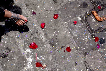 Flower petals and feet during Carnival parade.