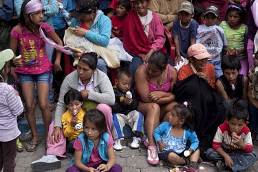 A crowd of women and children watch the 'mestizo' parade during Carnival.