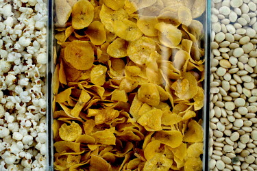 Snacks of popcorn, banana chips, and chochos, a bean-like seed, on sale during Carnival.