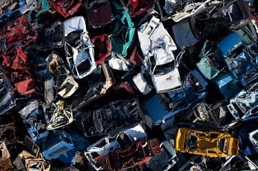 Cars lie in piles at a scrap metal yard in Gdansk.