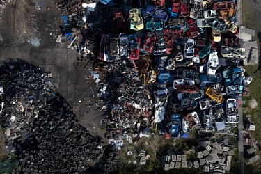 Cars lie in a piles at a scrap metal yard in Gdansk.