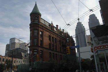 Toronto's Gooderham Building. The red brick building was completed in 1892 and is also known as the Flatiron Building.