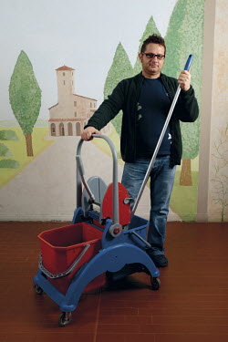 A man who has two degrees but works as a caretaker in a school in the small town of San Giorgio.