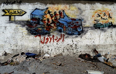 A graffiti picture on a wall in Gaza depicting a suicide car bomb attack on an Israeli bus.