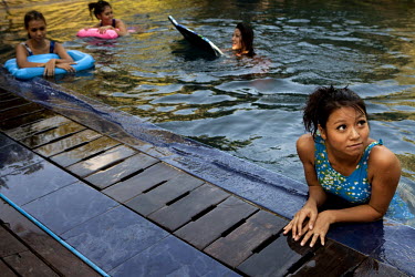 Wai Hnin (right) one of the 'Me N Ma Girls', Myanmar's first girl band, swims with her band mates during a break in the filming of a video to go with their next release. The band's members were recrui...