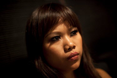 Kimmy one of the 'Me N Ma Girls', Myanmar's first girl band, waits to go on stage at her evening job as a bar singer. The band's members were recruited by Australian dancer Nicole May. They sing and d...