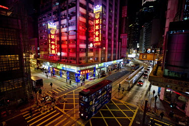 Trams and neon advertising in Hong Kong's Central District.