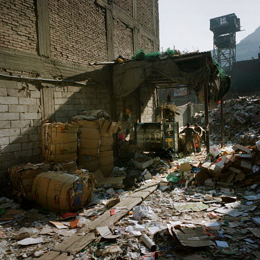 Zabbaleens press and package plastic bottles in Mokattam. The Zabbaleen are a minority Coptic religious community who have served as Cairo's informal rubbish collectors for the past 70 to 80 years. Th...