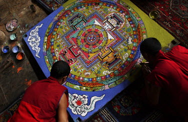 Ladakhi Buddhist monks construct a mandala with sand and the dust of precious stones inside the Thiksay monastery, 17 kilometers outside of Leh. After the festival the mandala will be destroyed, thus...