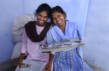 Pramila, left and Lalita read the newspaper at Mahila Shikshan Kendra, a Women's Education Centre in the block of Amos which is a cluster of villages located near the city of Patna. Bihar is the poore...