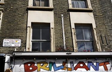 Windows above a shop called 'Brilliant' on Portobello Road.