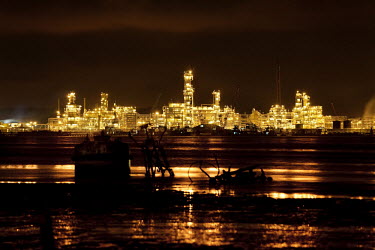 Chevron LPG installations lit up at night. Oil pollution in the Delta is causing tremendous problems for the local community.
