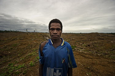 Thomas Klasibin, stands in front of what used to be the forest that supported his community. He is a Mooi, one of the indigenous people who live off the forests of West Papua. Their ancestral lands ar...