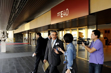The Syrian ambassador to the UN, Fayssal Al-Hamwi, is interviewed by a TV crew as he leaves the emergency debate on Syria held at the United Nations Human Rights Council in Geneva. The debate was call...