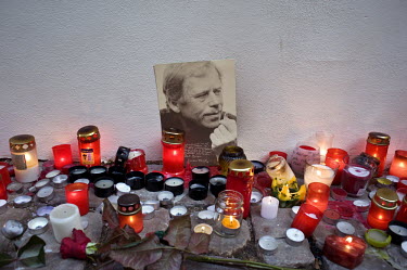 Candles surround a portrait of Vaclav Havel in Prague. Havel was a playwright, essayist and poet who became active as a dissident after the Soviet Invasion of Czechoslovakia and ended up being the las...