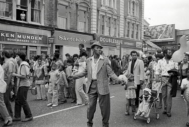 Revellers on Ladbroke Grove, West London during the Notting Hill Carnival.